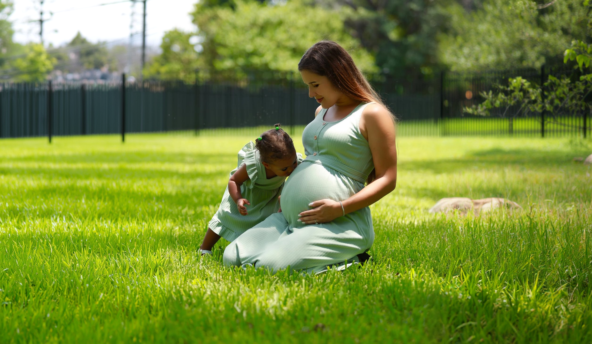 Expecting mother with her daughter